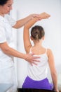 Chiropractor doing adjustment on female patient Royalty Free Stock Photo