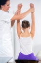 Chiropractor doing adjustment on female patient Royalty Free Stock Photo