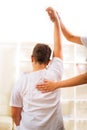 Chiropractor doing adjustment on male patient. Selective focus Royalty Free Stock Photo