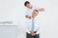 Chiropractor doing neck adjustment