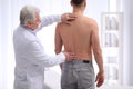 Chiropractor examining patient with back pain Royalty Free Stock Photo