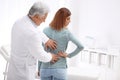 Chiropractor examining patient with back pain Royalty Free Stock Photo