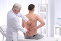 Chiropractor examining patient with back pain Royalty Free Stock Photo