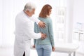 Chiropractor examining patient with back pain Royalty Free Stock Photo