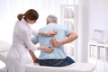 Chiropractor examining patient with back pain Royalty Free Stock Photo