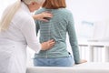 Chiropractor examining patient with back pain Royalty Free Stock Photo