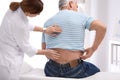 Chiropractor examining patient with back pain Royalty Free Stock Photo