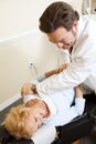Chiropractor Relieves Pain Royalty Free Stock Photo