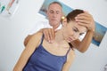 chiropractor working on young female patients back