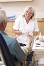 Chirpodist treating client in clinic Royalty Free Stock Photo