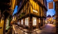 A Chirstmas night view of Shambles, a historic street in York featuring preserved medieval timber-framed buildings with jettied