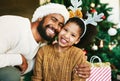 Chirtsmas, family and love with a father giving child a hug for happiness and care while together to celebrate Christian Royalty Free Stock Photo