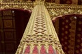 Chiseled gilded wall-stencilled black lacquer columns - Luang Prabang-Laos. Royalty Free Stock Photo