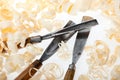 Chisels and wood shavings on white background Royalty Free Stock Photo