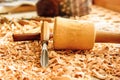 Chisels laid in wooden shavings on the desk Royalty Free Stock Photo