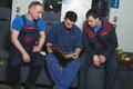 CHISINAU, MOLDOVA - APRIL 26, 2016: Workers in printing house. People working on printing machine in print factory. Industrial wor