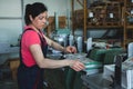 CHISINAU, MOLDOVA - APRIL 26, 2016: Workers in printing house. People working on printing machine in print factory. Industrial wor