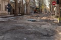 CHISINAU, MOLDOVA - CIRCA APR 2023: Road repair, the center of the city, empty street. Damaged street surface, repair process