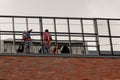 Chisinau, Moldova - July 14, 2019. People are working on the roof