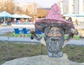 Chisinau, Moldova - March 27, 2021 A statue of a gnome with a pink hat