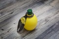 Lemon juice in a bottle, isolated, on a white background