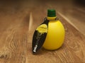 Lemon juice in a bottle, isolated, on a white background