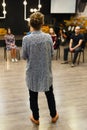 Chisinau, Republic of Moldova - April 30, 2018: Teacher of acting or business coach stands back in front of a group of students.