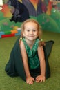 Chisinau, Republic of Moldova - July 15, 2019: Portrait of a cute little girl. Crawling through a fabric tunnel