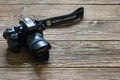 Chisinau, Republic of Moldova - March 14, 2018: dslr camera Minolta a 7 and lens on wooden background in Chisinau, Republic of Mol