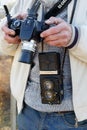 Chisinau, Republic of Moldova - March 30, 2019: A man photographer holds the retro photo camera Rolleiflex medium format twin-lens Royalty Free Stock Photo