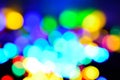 Chistmas background with coloutful bokeh in light and dark blue, yellow, orange, green, purple. Defocused