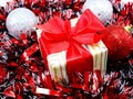 chistmas background with gift box and red tinsel