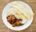 Chita ruti a Bengali cuisine with hot chicken curry Royalty Free Stock Photo