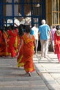 Women pilgrims wear red sarees in the Shiva Nataraja temple