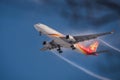 Cathay Dragon Airline landing to Chitose International airport with vapor trail