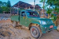 CHITWAN, NEPAL - NOVEMBER 03, 2017: Green car parked waiting for tourists for jungle safari at Chitwan National Park