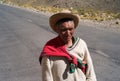 Peruvian Farmer Walking Along a Lonely Mountain Road