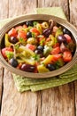 Chlada felfel African vegetable salad with anchovies close-up in a bowl. vertical Royalty Free Stock Photo