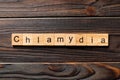 Chlamydia word written on wood block. chlamydia text on table, concept