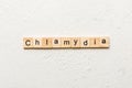 chlamydia word written on wood block. chlamydia text on table, concept