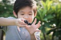 Chld playing fidget spinner on nature background Royalty Free Stock Photo