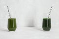 Chlorella and spirulina drinks on a gray background. Healthy detox green drink. Natural supplement with algae. Space for text Royalty Free Stock Photo