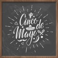 Cinco de mayo vector letteing logo with chalkboard background.