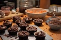 chocoholic baking chocolate cupcakes for friends birthday party Royalty Free Stock Photo