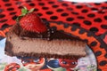 chocolade cake with strawbery on the flybug and cat plate