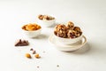 Chocolate, almonds and oatmeal energy balls in white bowl on white background Royalty Free Stock Photo