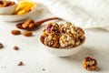 Chocolate, almonds, orange and oatmeal energy balls in white bowl on white background Royalty Free Stock Photo