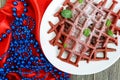 Chocolate American waffles `Red velvet` on a white ceramic plate