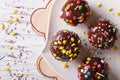 Chocolate apples with sprinkles candy close up horizontal top vi