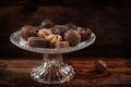 Chocolate, assortment of pralines on an elegant glass ÃÂ©tagÃÂ¨re Royalty Free Stock Photo